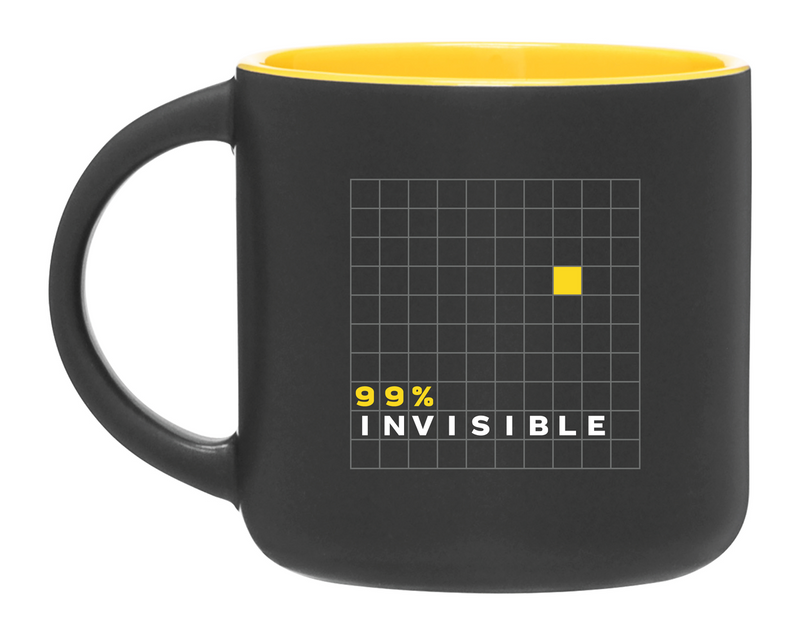 A black mug with a yellow interior, featuring a grid design and the text '99% INVISIBLE.'