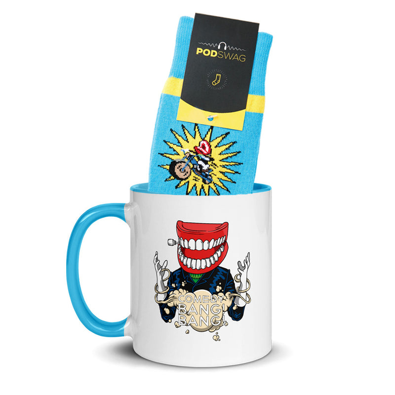 A colorful mug with a Comedy Bang! Bang! Motor Mouth graphic and blue socks with Motormouth design in yellow starburst design are displayed together.