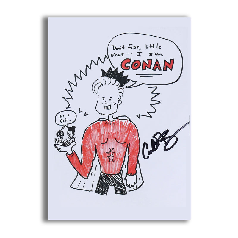 Close up of signed print in a comical, hand-drawn style depicting Conan as a superhero wearing a cape and crown holding 2 tiny people in his hand and a black and red text bubble of him saying: 'Don't fear, little ones..I am CONAN.'