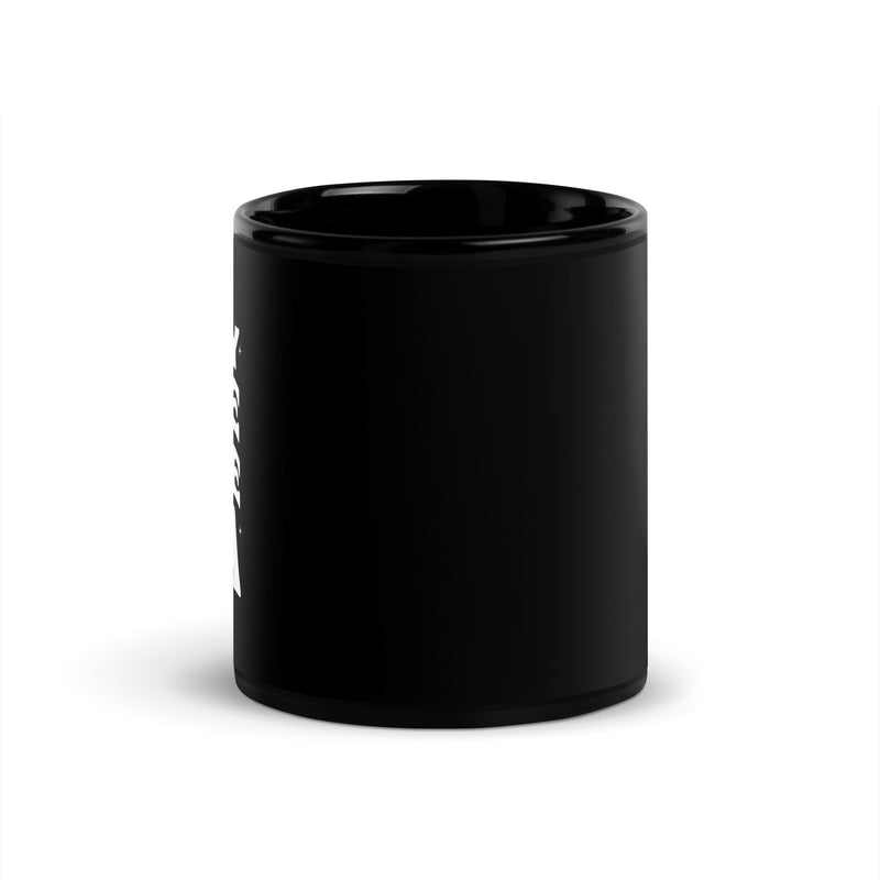 A black glossy coffee mug shown from a side angle, with part of the white text design visible curving slightly around the surface.