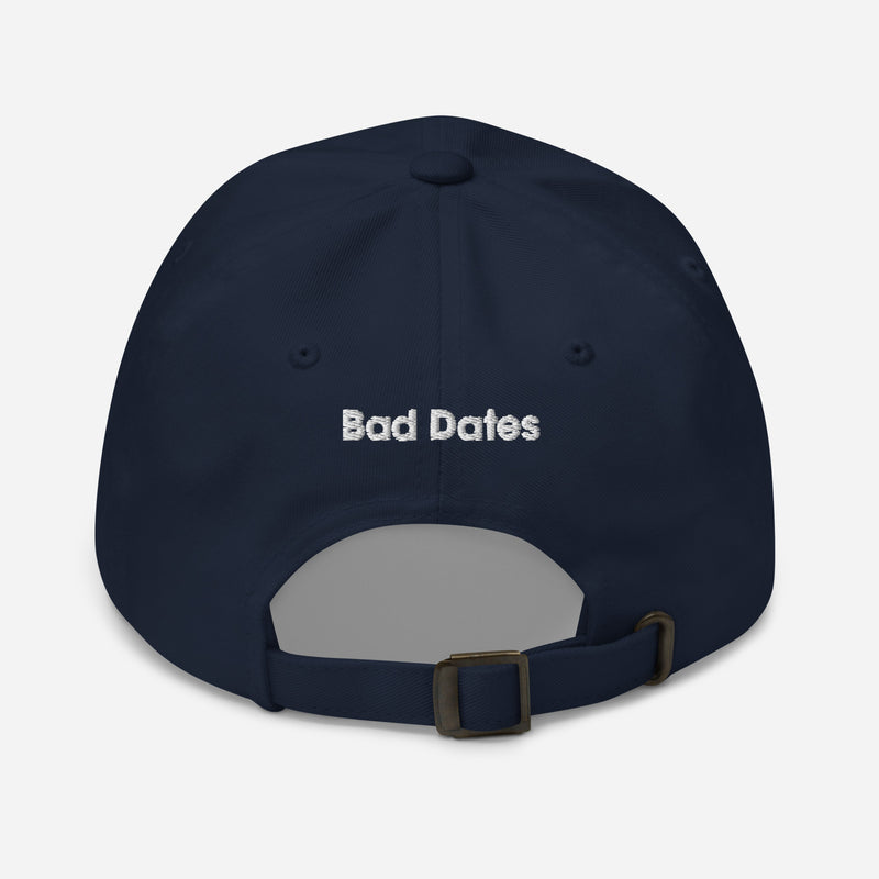 Back of navy blue baseball cap with 'Bad Dates' in white text.