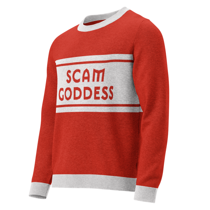 A red sweater with gray cuffs and collars featuring the text 'SCAM GODDESS' against a grey stripe.