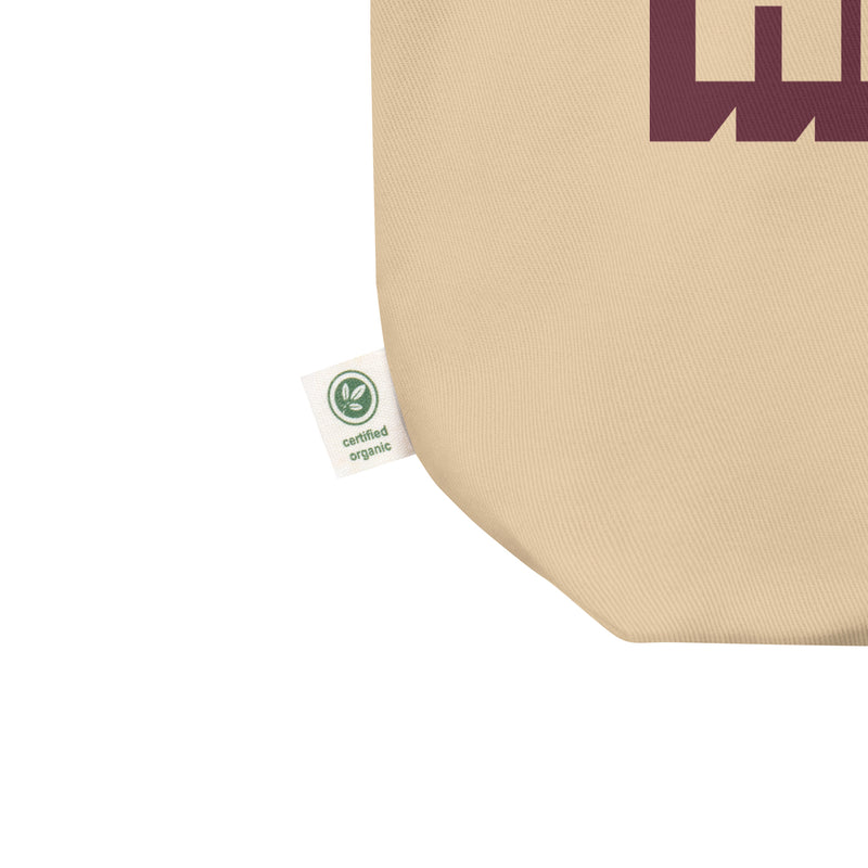 Close up of tote bag's corner featuring a tag that reads 'certified organic.'