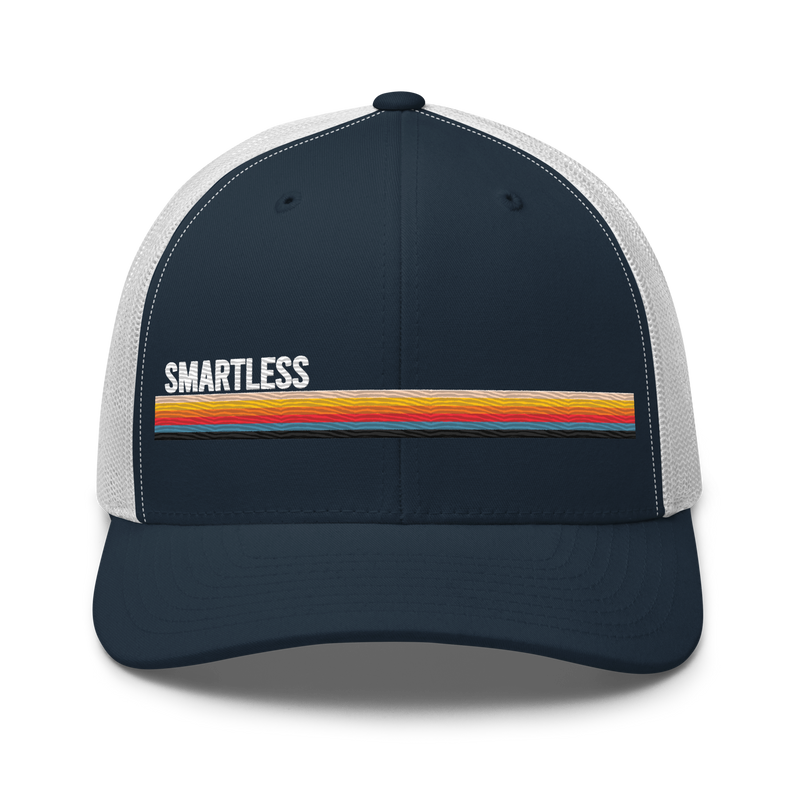 Baseball cap with a navy front, white mesh sides, and the word 'SMARTLESS' in white above a colorful horizontal stripe.