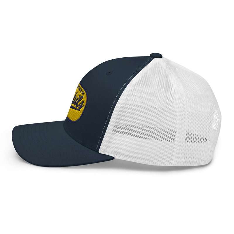 Navy and white trucker cap with a round yellow and purple patch logo on the front.