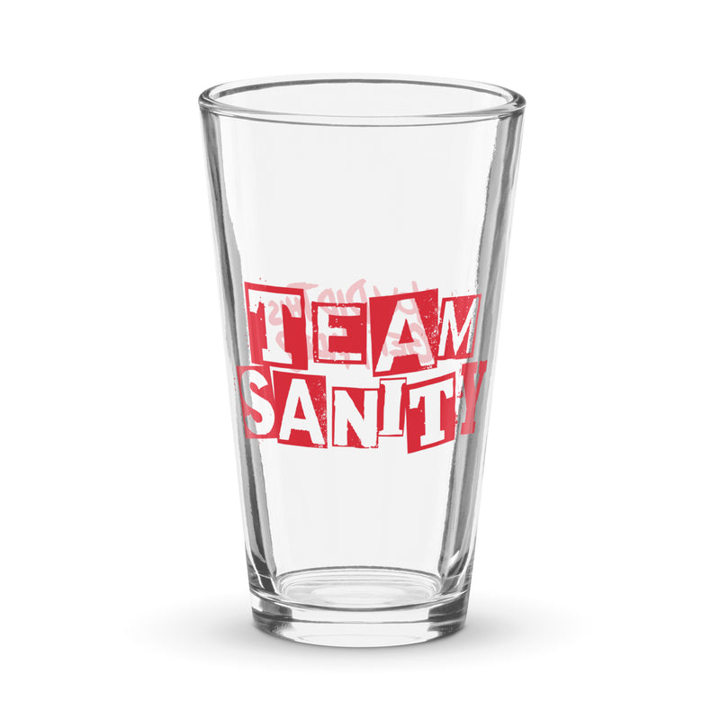 clear glass pint glass with red text reading TEAM SANITY