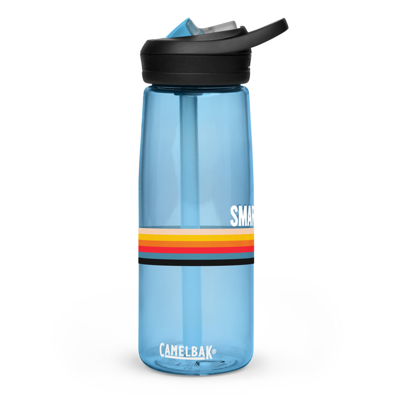 A blue water bottle with the word 'SMARTLESS' printed on it, featuring a colorful striped band around the middle and a black cap.