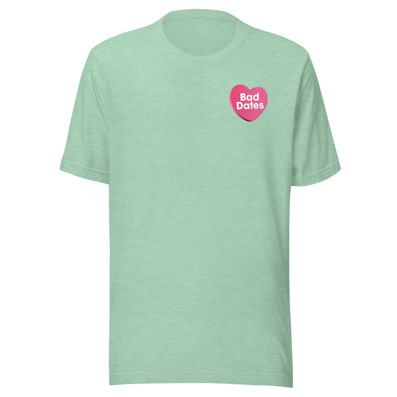 Front of green t-shirt with 'Bad Dates' written in a pink heart on the left chest.