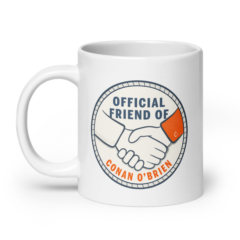 mug featuring handshake design with text saying Official Friend of Conan O'Brien