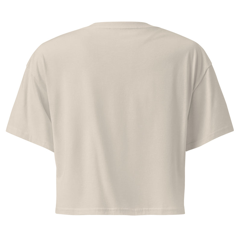 The backside of the off-white cropped t-shirt, shown without any visible designs or text. The fabric appears smooth, with a relaxed fit.