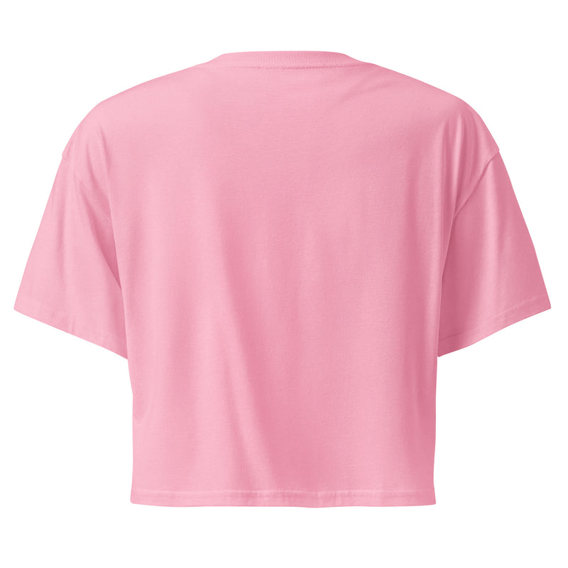 The backside of the pink cropped t-shirt, shown without any visible designs or text. The fabric appears smooth, with a relaxed fit.