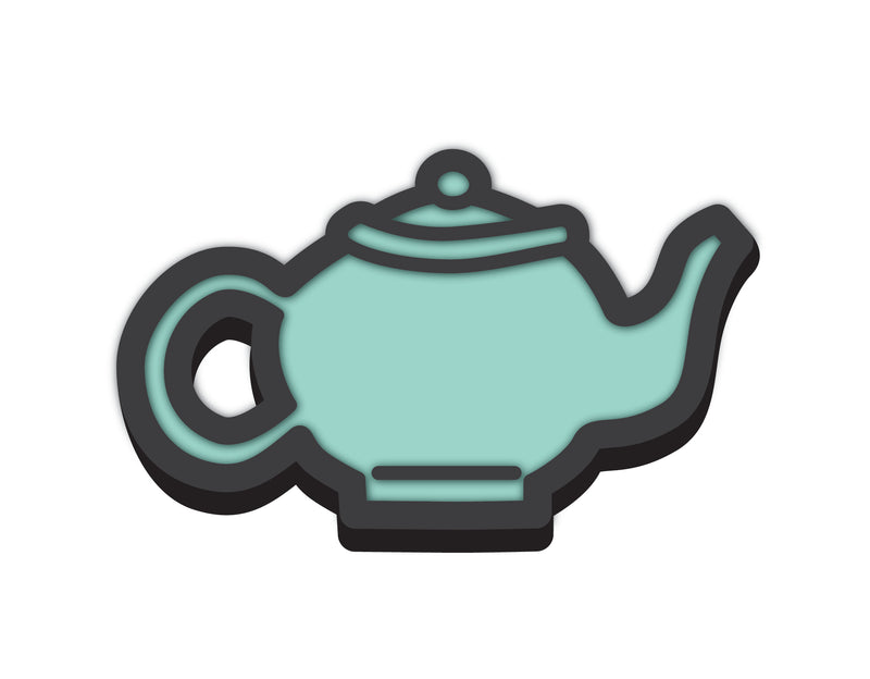 Rubber shoe charm of stylized mint green teapot with a black outline and lid, featuring a curved handle.