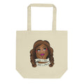 Cream tote bag featuring the Illustration of a woman with long hair, resting her chin on her hands, with text banners reading 'What a treat, What a dream.'