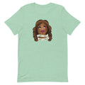 Mint green t-shirt featuring an Illustration of a woman with brown hair and bold makeup, featuring a banner with the text 'What A Treat, What A Dream.'