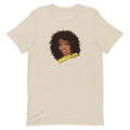 Cream colored t-shirt featuring cartoon illustration of a smiling woman with curly hair and the text 'Nailed It!'